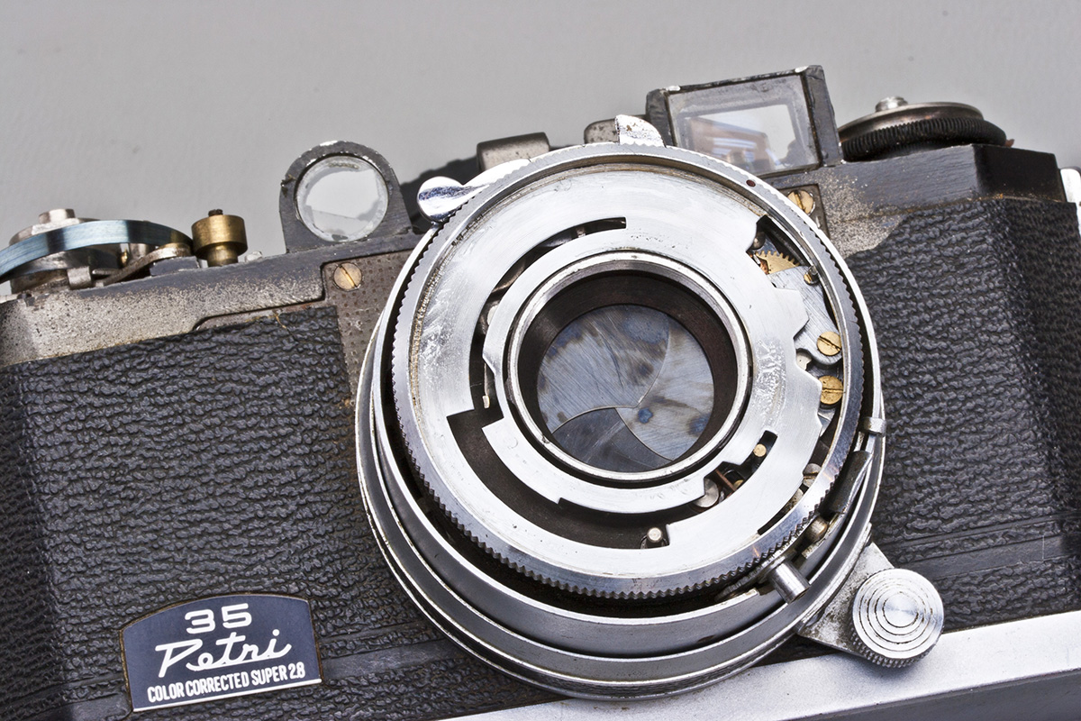 Remove shutter-speed cam disk.